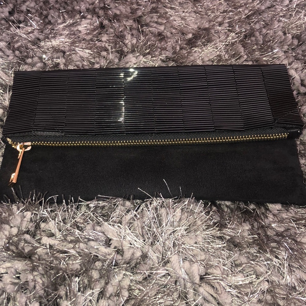 The limited faux suede clutch